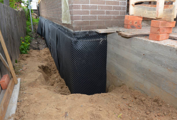 Happy homeowners after waterproofing job in Pelham